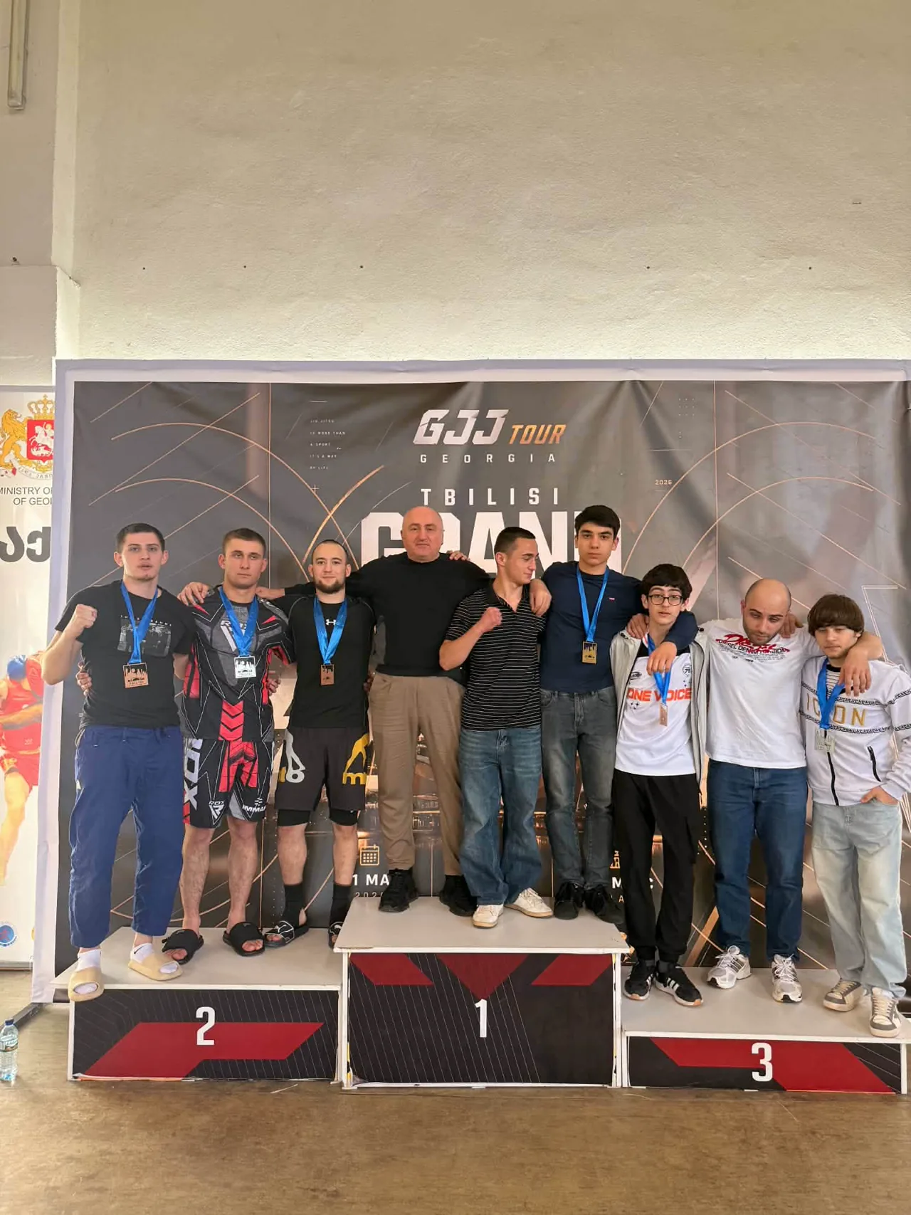 Davitferuli medalists and coach